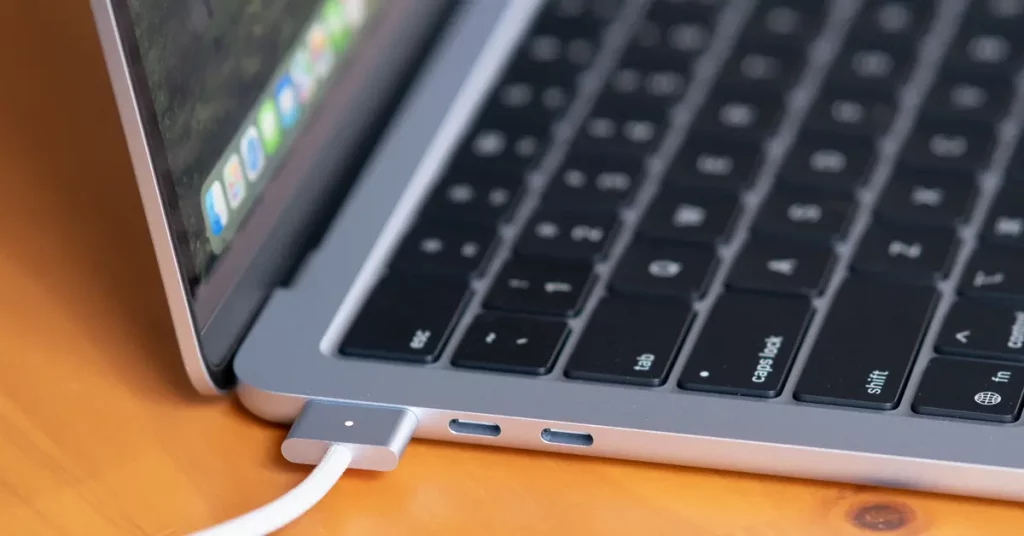 MacBook Air M4 (2025) on a desk next to a coffee mug, showing its thin design and sleek form factor